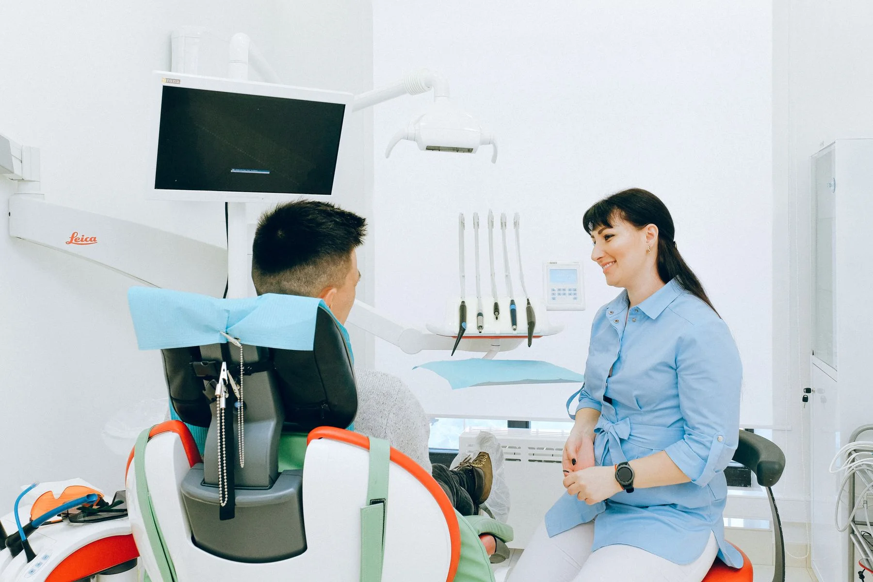 Adult discussing treatment options during a private clinical consultation
